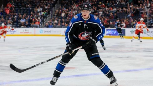 Columbus Blue Jackets left wing Patrik Laine skates for the loose puck against the Calgary Flames in the first period at Nationwide Arena.