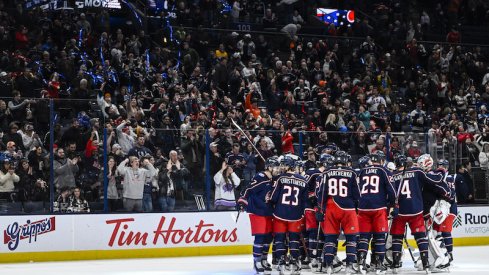 The Columbus Blue Jackets celebrate their overtime win over the Los Angeles Kings at Nationwide Arena.