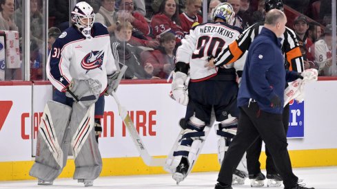 Columbus Blue Jackets' Michael Hutchinson substitutes teammate Elvis Merzlikins during the second period against the Montreal Canadiens at the Bell Centre.