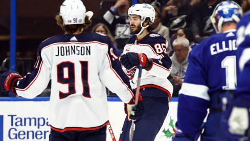 Columbus Blue Jackets' Kirill Marchenko is congratulated by Columbus Blue Jackets' Kent Johnson after he scored a goal against the Tampa Bay Lightning during the second period at Amalie Arena.