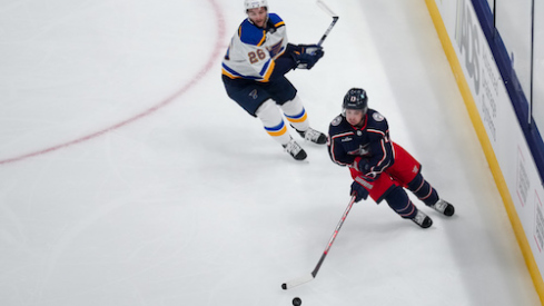 Columbus Blue Jackets left wing Johnny Gaudreau (13) skates with the puck against St. Louis Blues left wing Nathan Walker (26) in the first period at Nationwide Arena.