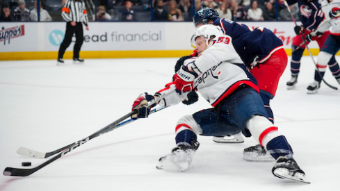 Washington Capitals forward Ethan Frank (53) skates with puck against Columbus Blue Jackets defenseman Jake Christiansen (23) in the third period at Nationwide Arena.