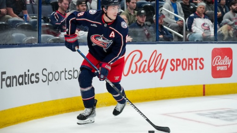 Columbus Blue Jackets defenseman Zach Werenski (8) skates with the puck against the Philadelphia Flyers in the second period at Nationwide Arena.