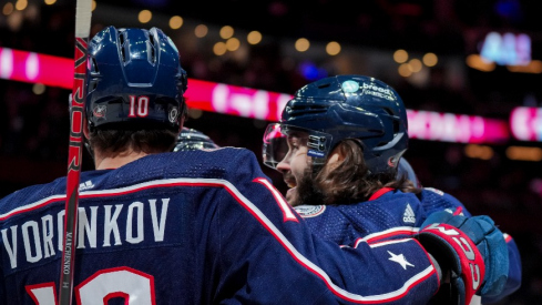 Columbus Blue Jackets left wing Kirill Marchenko (86) celebrates with teammates after scoring a goal against the Tampa Bay Lightning in the first period at Nationwide Arena.