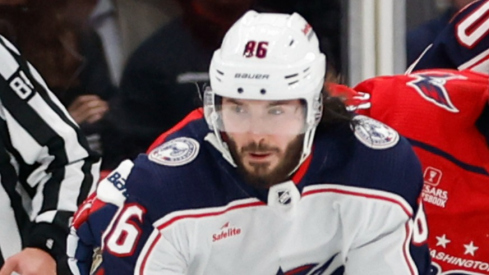 Columbus Blue Jackets left wing Kirill Marchenko (86) skates with the puck as Washington Capitals defenseman Nick Jensen (3) defends in the third period at Capital One Arena.