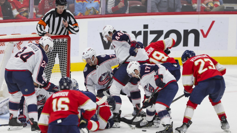 Florida Panthers center Carter Verhaeghe hunts for a loose puck