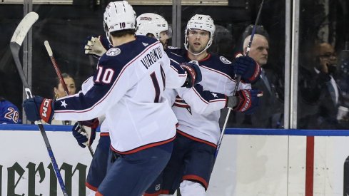 Adam Fantilli celebrates with his teammates after scoring in the second period against the New York Rangers