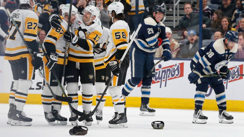 Pittsburgh Penguins center Sidney Crosby (87) celebrates his hat trick goal during the third period against the Columbus Blue Jackets at Nationwide Arena.