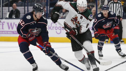 Columbus Blue Jackets' Alexander Texier sticks the puck away from Arizona Coyotes' Clayton Keller during the first period at Nationwide Arena.