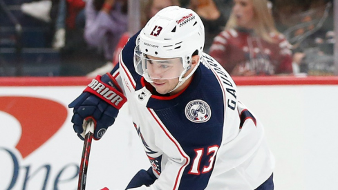 Columbus Blue Jackets left wing Johnny Gaudreau (13) shoots the puck as Washington Capitals defenseman Rasmus Sandin (38) defends during the second period at Capital One Arena.