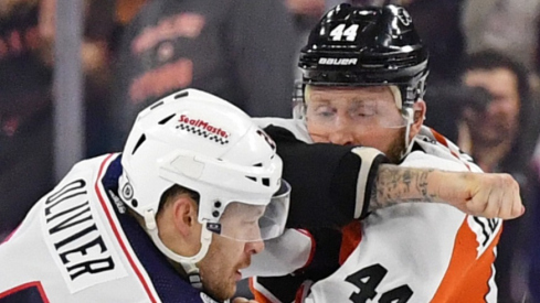 Columbus Blue Jackets right wing Mathieu Olivier (24) and Philadelphia Flyers left wing Nicolas Deslauriers (44) fight during the first period at Wells Fargo Center.