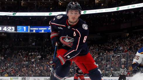 Columbus Blue Jackets defenseman Zach Werenski (8) tracks down a loose puck against the St. Louis Blues during the first period at Nationwide Arena.