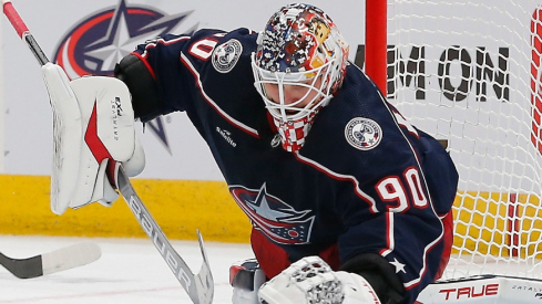 Columbus Blue Jackets goalie Elvis Merzlikins (90) reaches for a loose puck against the Los Angeles Kings during the second period at Nationwide Arena.