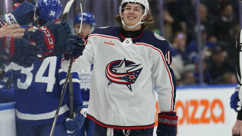 Columbus Blue Jackets' Kent Johnson gets congratulated after scoring against the Toronto Maple Leafs during the first period at Scotiabank Arena.