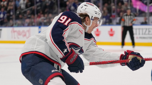 Columbus Blue Jackets forward Kent Johnson (91) scores the game winning goal against the Toronto Maple Leafs during the overtime at Scotiabank Arena.