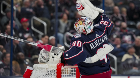 Columbus Blue Jackets goaltender Elvis Merzlikins throws his water bottle