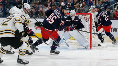 Columbus Blue Jackets right wing Kirill Marchenko (86) clears a rebound against the Boston Bruins during the second period at Nationwide Arena.