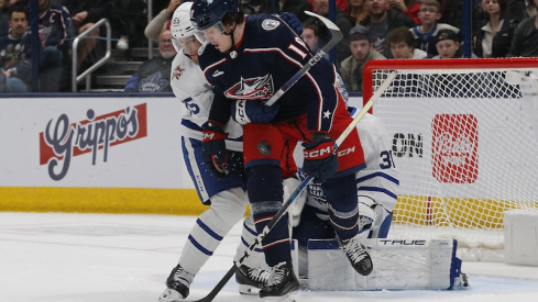 Columbus Blue Jackets' Dmitri Voronkov has a shot attempt hit him against the Toronto Maple Leafs during the first period at Nationwide Arena.