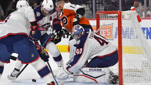 Columbus Blue Jackets defenseman Erik Gudbranson (44) and goaltender Daniil Tarasov (40) try to cover the puck against Philadelphia Flyers right wing Travis Konecny (11) during the first period at Wells Fargo Center.