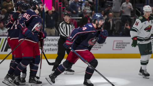 Columbus Blue Jackets' Cole Sillinger celebrates with teammates after scoring a hat-trick goal against the Minnesota Wild in the third period at Nationwide Arena.