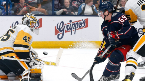 Pittsburgh Penguins goalie Magnus Hellberg (45) makes a save as Columbus Blue Jackets right wing Jordan Dumais (69) looks for a rebound during the second period at Nationwide Arena.