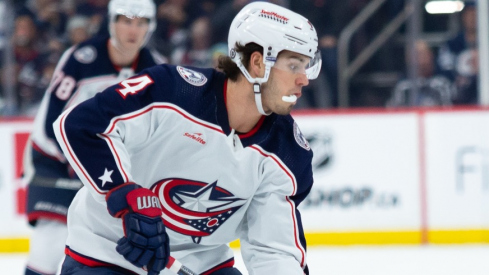 Columbus Blue Jackets forward Cole Sillinger(4) skates in on Winnipeg Jets defenseman Brenden Dillon (5) during the first period at Canada Life Centre.