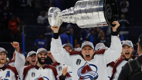 Colorado Avalanche defenseman Jack Johnson (3) celebrates with the Stanley Cup after the Avalanche game against the Tampa Bay Lightning in game six of the 2022 Stanley Cup Final at Amalie Arena.