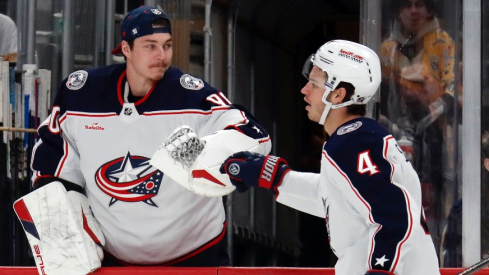 Columbus Blue Jackets goaltender Elvis Merzlikins (90) congratulates center Cole Sillinger (4) on his goal against the Pittsburgh Penguins during the second period at PPG Paints Arena.