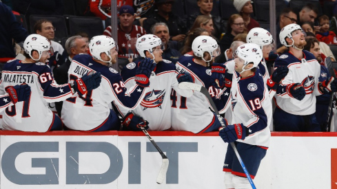 Columbus Blue Jackets center Adam Fantilli (19) celebrates with teammates after scoring a goal against the Washington Capitals in the first period at Capital One Arena.