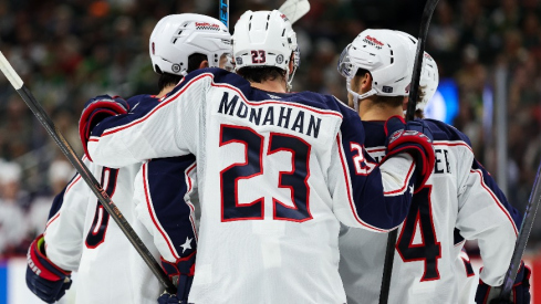 Columbus Blue Jackets defenseman Zach Werenski (8) celebrates his goal with teammates during the third period against the Minnesota Wild at Xcel Energy Center.