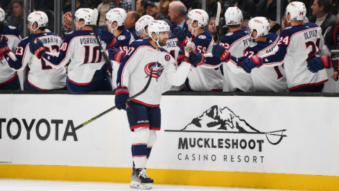 Columbus Blue Jackets center Zachary Aston-Reese (27) celebrates with the bench after scoring a goal against the Seattle Kraken during the first period at Climate Pledge Arena.