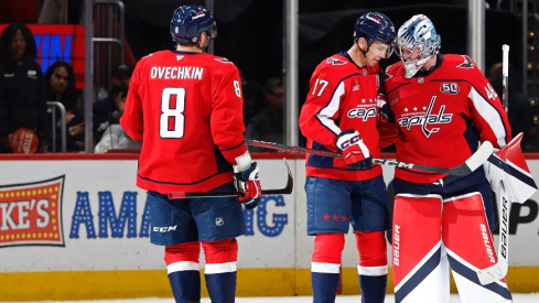 Washington Capitals goaltender Logan Thompson (48) celebrates with Capitals center Dylan Strome (17) and Capitals left wing Alex Ovechkin (8) after their game against the Columbus Blue Jackets at Capital One Arena.