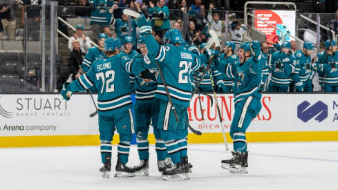 San Jose Sharks defenseman Jack Thompson (26) and San Jose Sharks left wing William Eklund (72) and teammates celebrate after the goal against the Columbus Blue Jackets during the second period at SAP Center at San Jose.