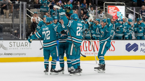 San Jose Sharks defenseman Jack Thompson (26) and San Jose Sharks left wing William Eklund (72) and teammates celebrate after the goal against the Columbus Blue Jackets during the second period at SAP Center at San Jose.