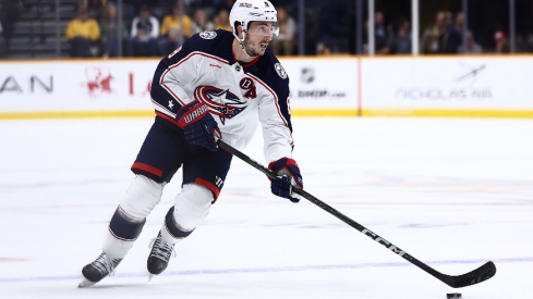 Columbus Blue Jackets defenseman Zach Werenski (8) brings the puck over the blue line in overtime against the Nashville Predators at Bridgestone Arena.