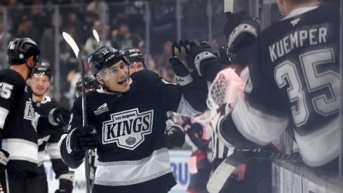 Los Angeles Kings left wing Trevor Moore (12) celebrates with teammates after scoring during the third period against the Columbus Blue Jackets at Crypto.com Arena.