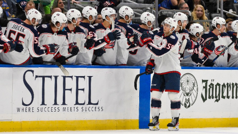 Columbus Blue Jackets right wing Yegor Chinakhov (59) is congratulated by teammates after scoring against the St. Louis Blues during the second period at Enterprise Center.