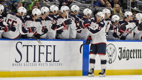 Columbus Blue Jackets right wing Yegor Chinakhov (59) is congratulated by teammates after scoring against the St. Louis Blues during the second period at Enterprise Center.