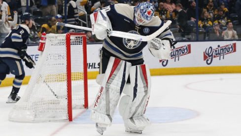 Columbus Blue Jackets goalie Elvis Merzlikins (90) celebrates the win over Pittsburgh Penguins at the end of the third period at Nationwide Arena.