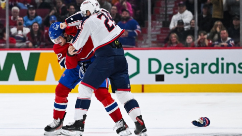 Columbus Blue Jackets right wing Mathieu Olivier (24) and Montreal Canadiens defenseman Arber Xhekaj (72) fight during the second period at Bell Centre.