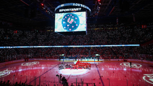 Johnny Gaudreau’s family during ceremonial puck drop by Columbus Blue Jackets center Sean Monahan (23) and Calgary Flames center Mikael Backlund (11) during the first period at Scotiabank Saddledome.