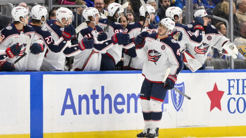 Columbus Blue Jackets center Cole Sillinger (4) is congratulated by teammates after scoring against the St. Louis Blues during the second period at Enterprise Center.