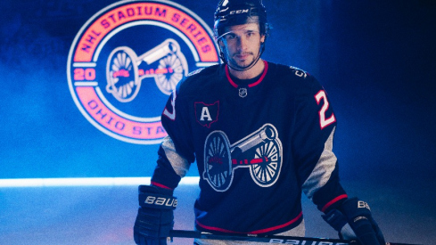 Columbus Blue Jackets center Sean Monahan sports the team's jersey for the 2025 NHL Stadium Series at Ohio Stadium.