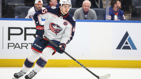 Luca Del Bel Belluz controls the puck against the New York Islanders