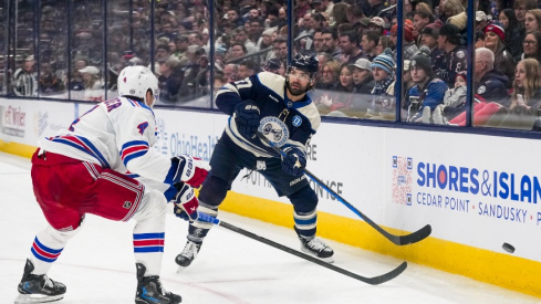 Columbus Blue Jackets center Zachary Aston-Reese (27) passes the puck against New York Rangers defenseman Braden Schneider (4) in the second period at Nationwide Arena on Saturday, Feb. 8, 2025 in Columbus, Ohio.