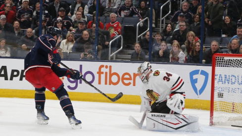 Columbus Blue Jackets defenseman Zach Werenski (8) shot on the breakaway beats Chicago Blackhawks goalie Petr Mrazek (34) for a goal during the third period at Nationwide Arena.