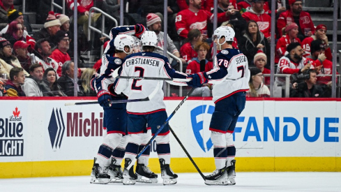 Columbus Blue Jackets center Sean Kuraly (7) celebrates his goal with teammates during the second period against the Detroit Red Wings at Little Caesars Arena.