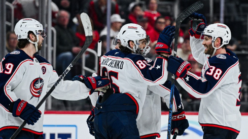 Columbus Blue Jackets center Sean Kuraly (7) celebrates his goal with teammates during the second period against the Detroit Red Wings at Little Caesars Arena.