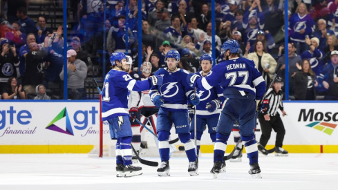 Tampa Bay Lightning defenseman Victor Hedman (77) celebrates with center Brayden Point (21) and left wing Brandon Hagel (38) after scoring a goal against the Columbus Blue Jackets in the third period at Amalie Arena.