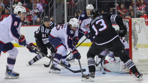 Columbus Blue Jackets goaltender Elvis Merzlikins (90) makes a save on New Jersey Devils center Nico Hischier (13) during the second period at Prudential Center.